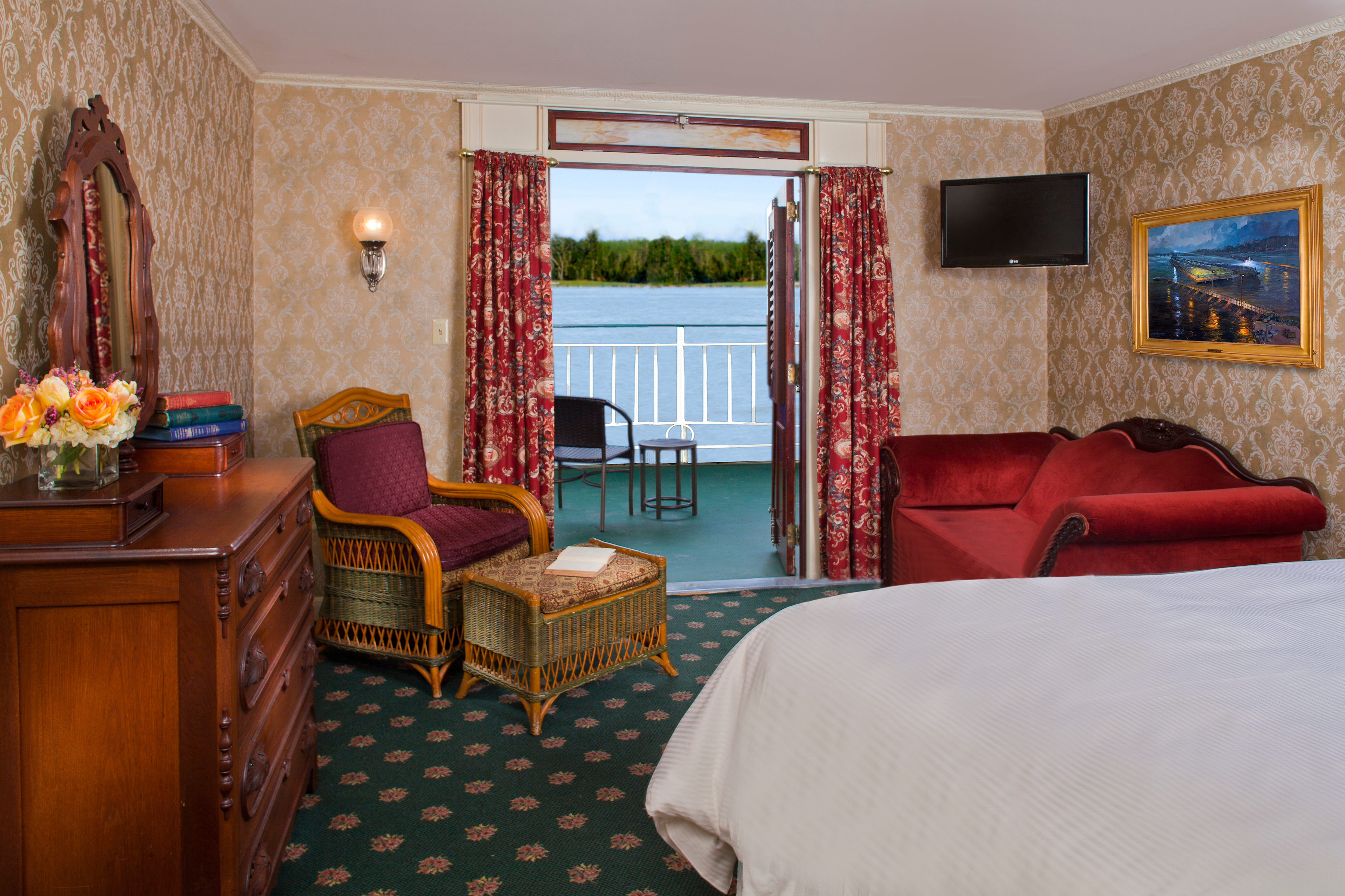 American Queen Steamboat Company American Queen Accommodation Deluxe Outside Stateroom with Veranda.jpg
