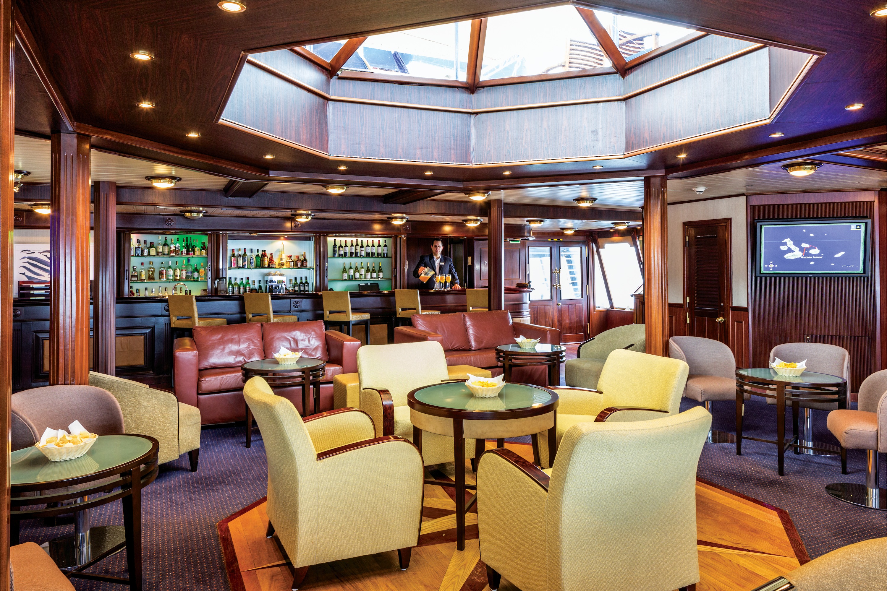 Lindblad Expeditions National Geographic Islander Interior Lounge & Bar.jpg