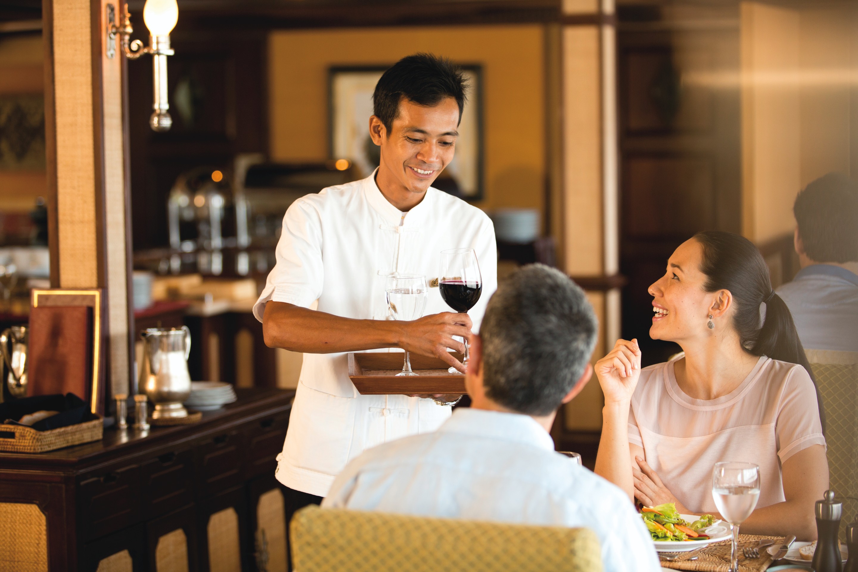Belmond River Cruises Road to Mandalay Interior Restaurant Staff.jpg