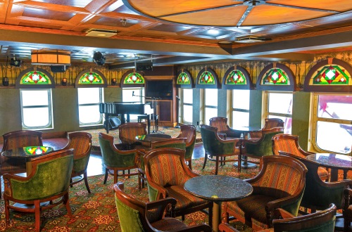American Queen Steamboat Company American Empress Interior Paddlewheel Lounge Table and Stage.jpg
